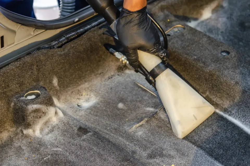 Extraction cleaning on a car carpet