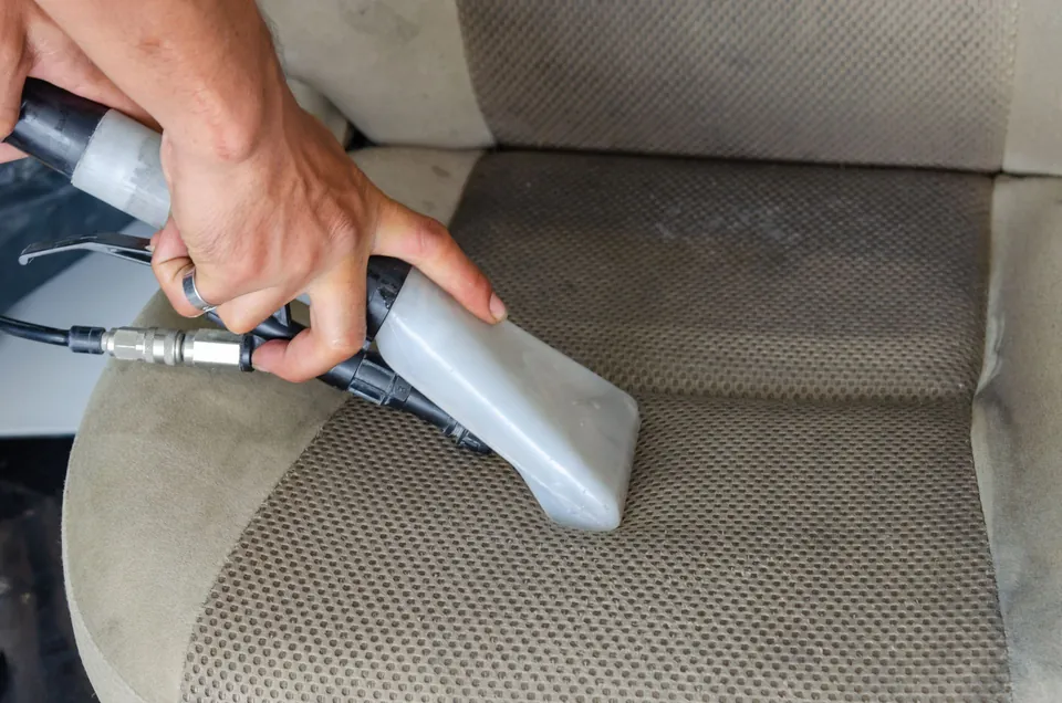 Extraction cleaning on a fabric car seat